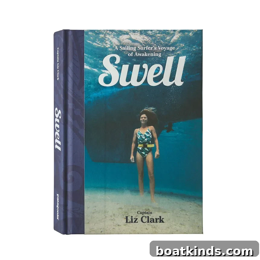 Sailboat anchored in tropical waters with surfboards onboard