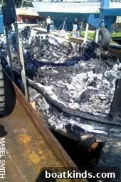 Investigators examine burned trawler remains