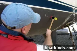Surveyor inspecting hull