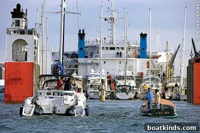 Stanchions and straps securing yachts on deck