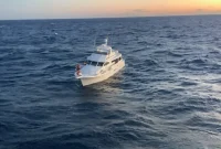 Coast Guard Rescues 3 People from Sinking Boat