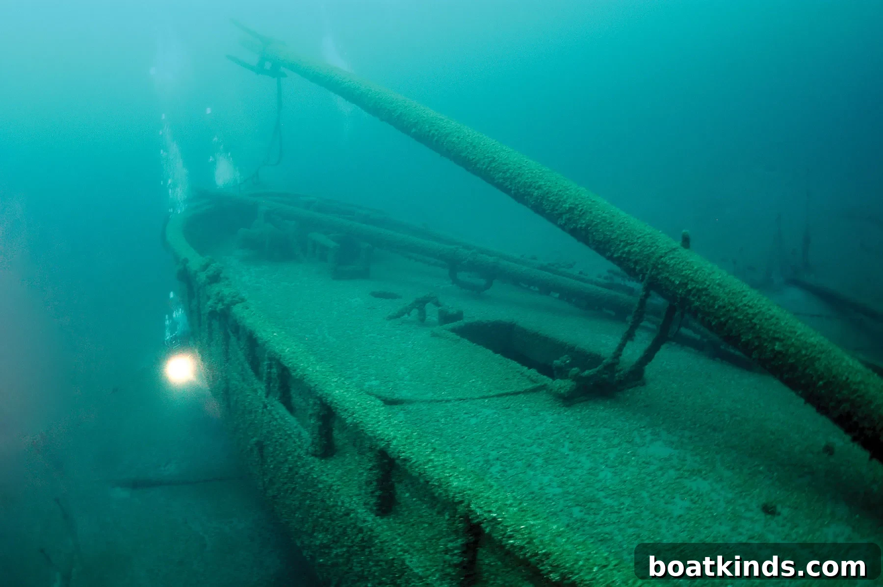 Diver exploring a preserved shipwreck along the Wisconsin shoreline