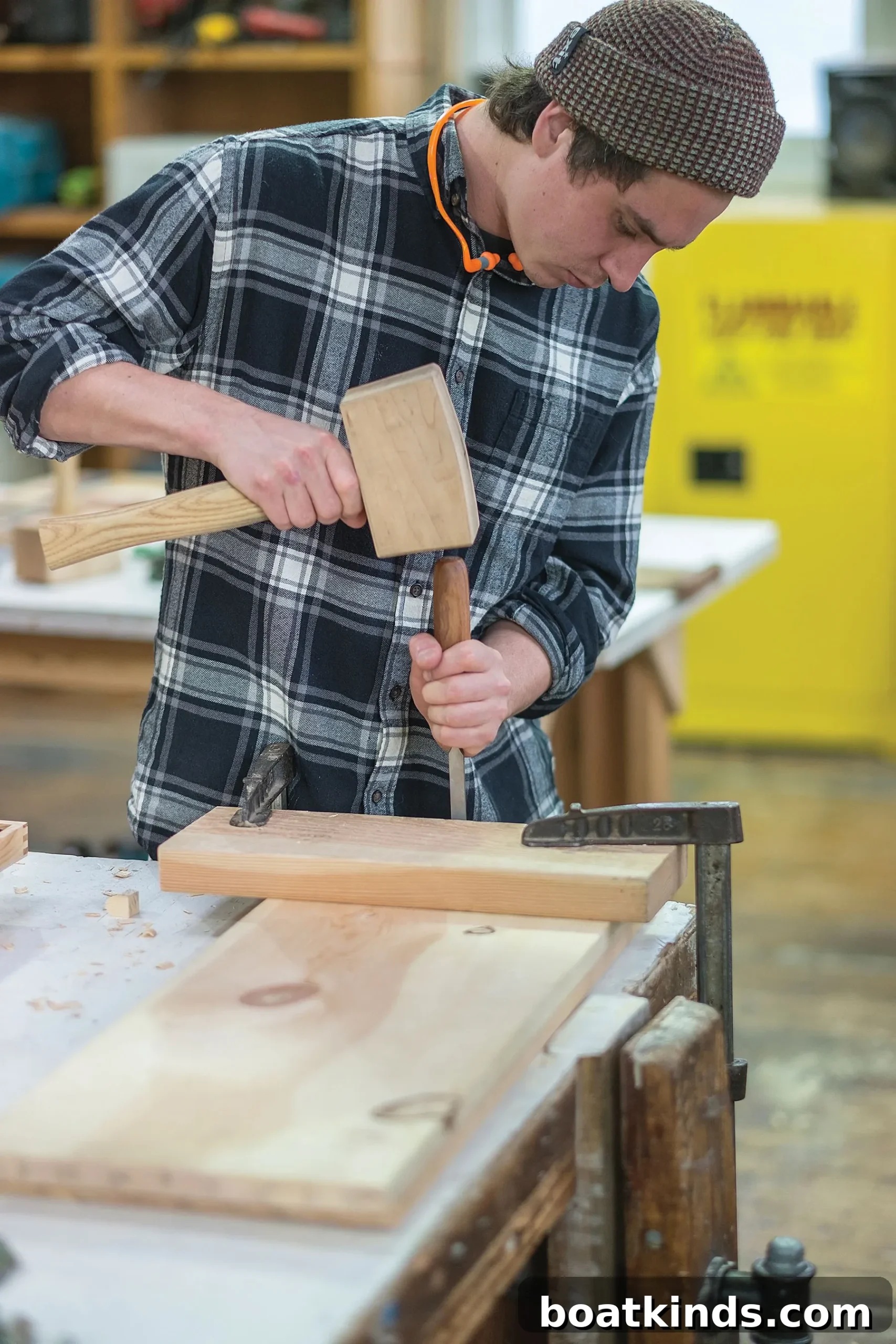 Students measuring and shaping wood in the workshop