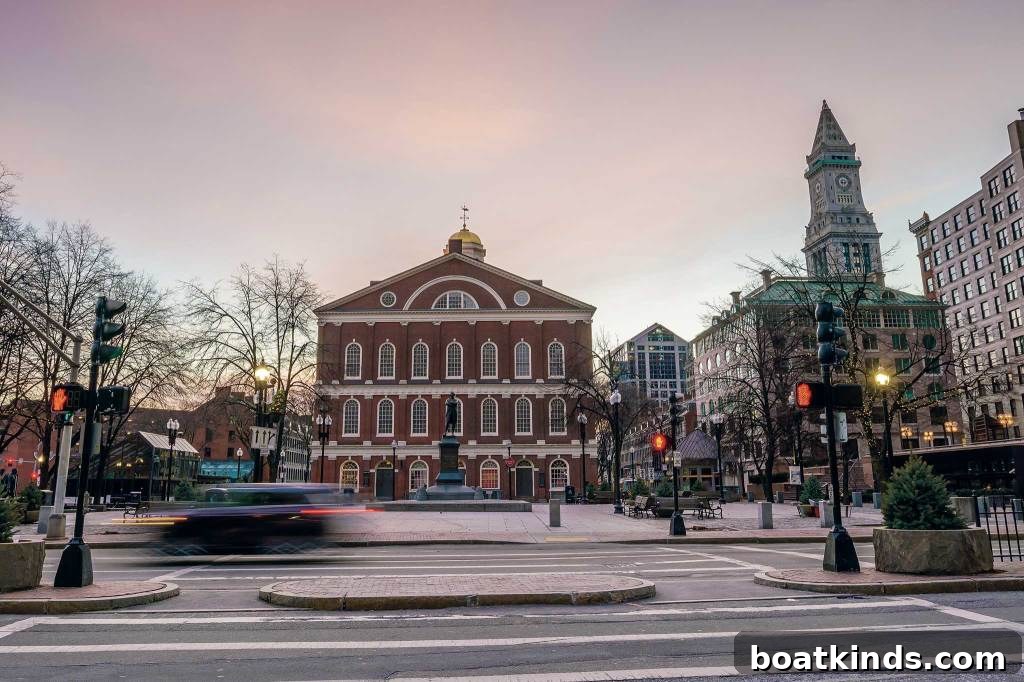 View of a brick building with a statue in front of it. Quincy Marketplace