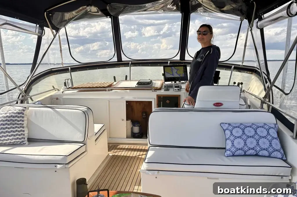 Why Owners Chose the Grand Banks 46 4 A woman at the bridge of a boat
